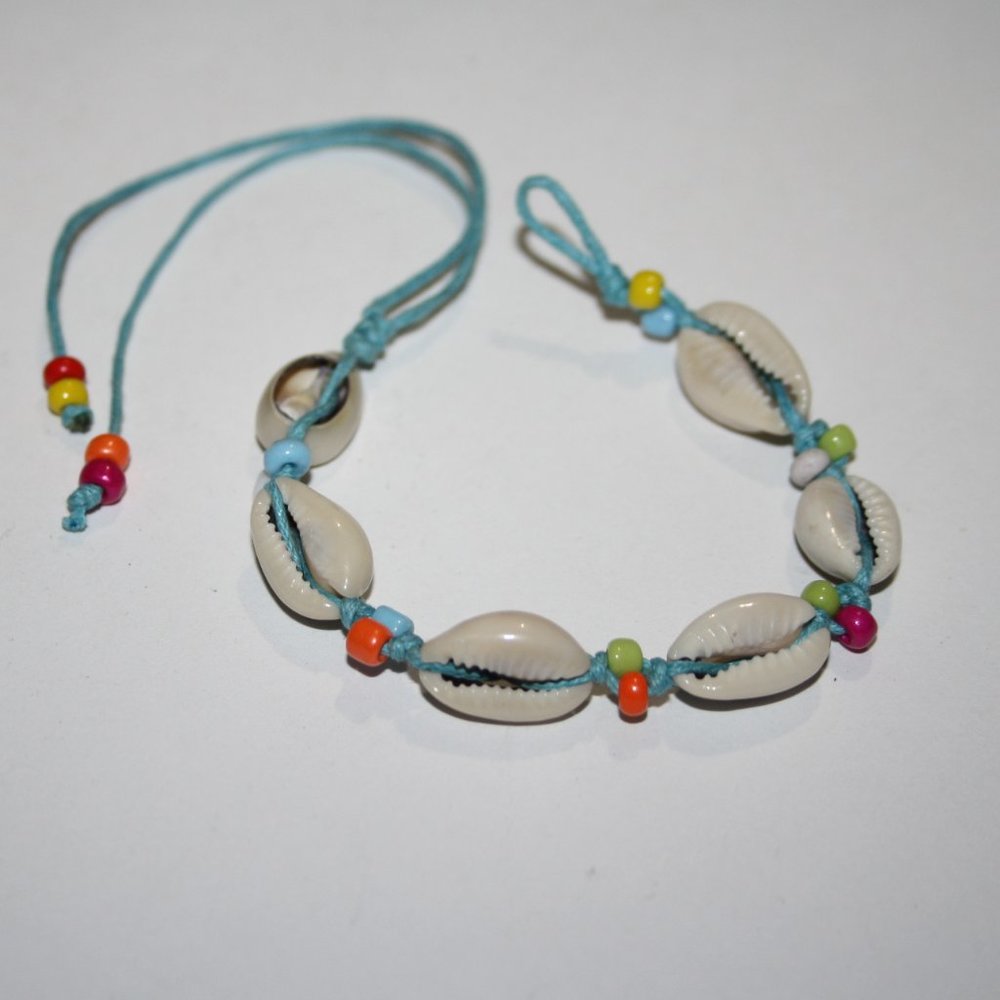 Beautiful blue and shell tie on bracelet 6.5-9"